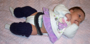 diaper belt holds a prefold diaper securely in place